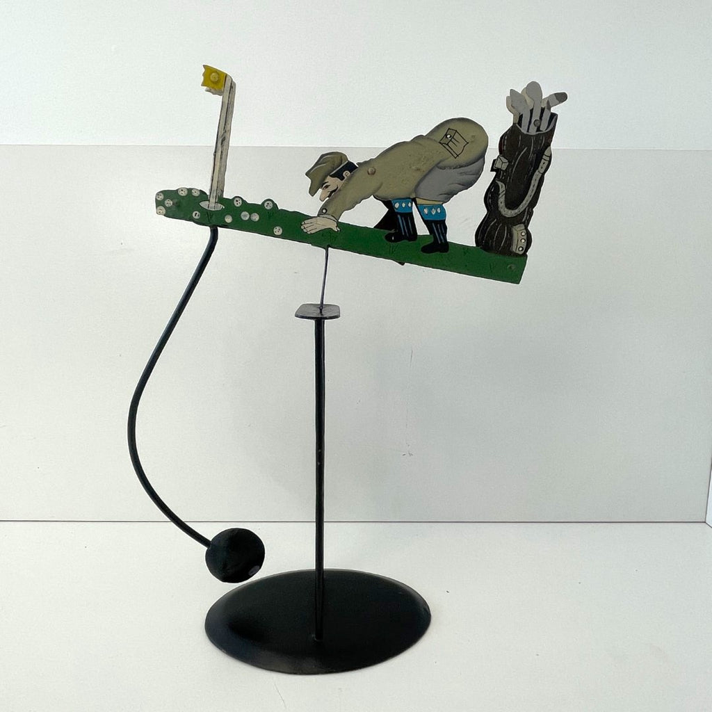 Pendulum Balance Figure - Golfer Lining Up His Putt
