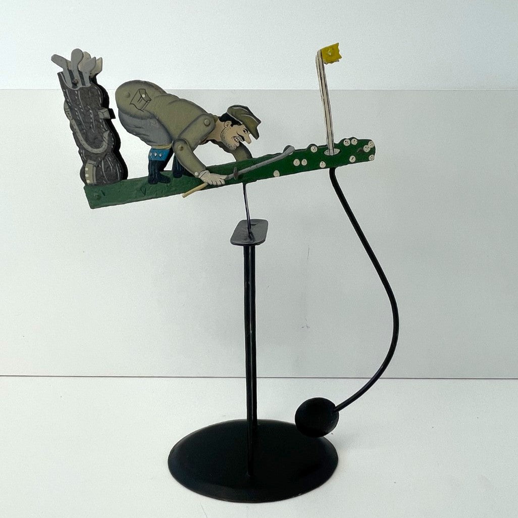 Pendulum Balance Figure - Golfer Lining Up His Putt