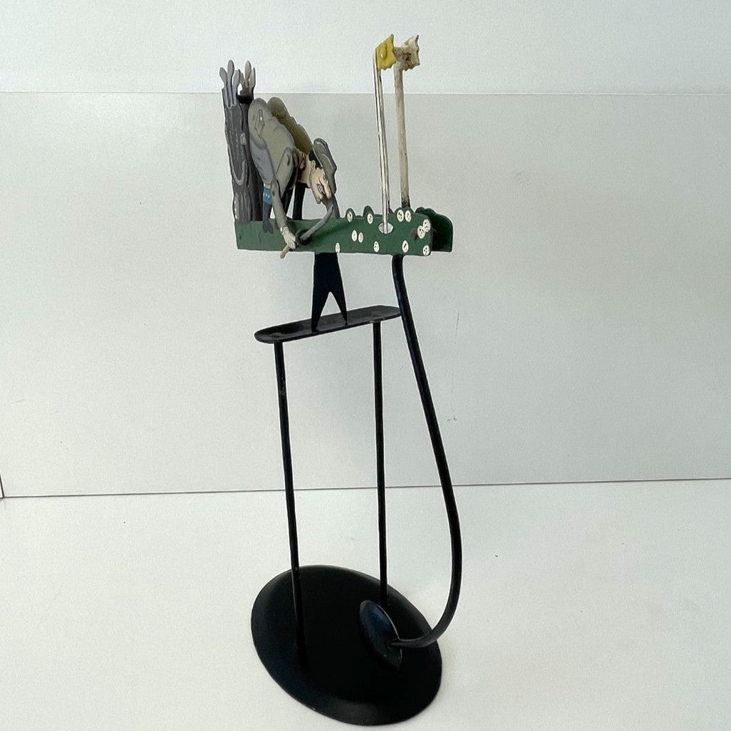 Pendulum Balance Figure - Golfer Lining Up His Putt