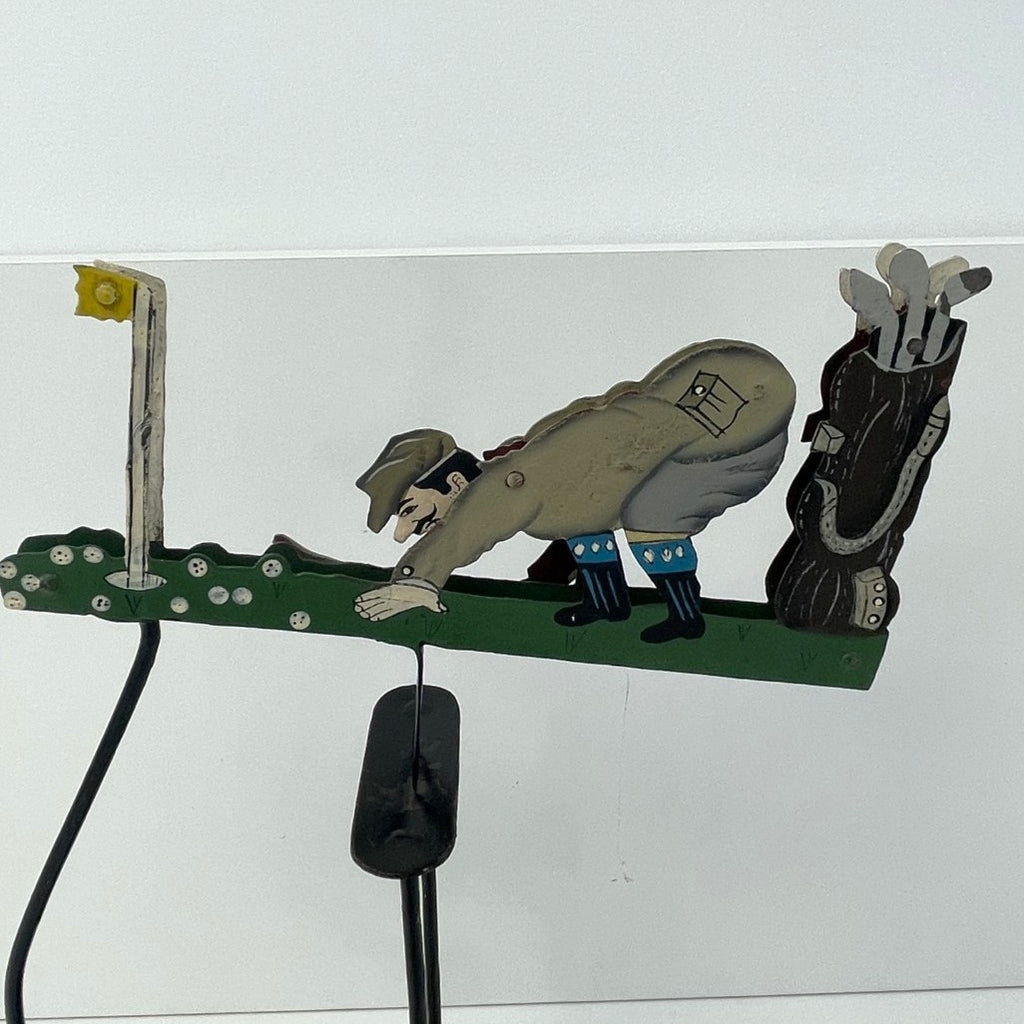 Pendulum Balance Figure - Golfer Lining Up His Putt