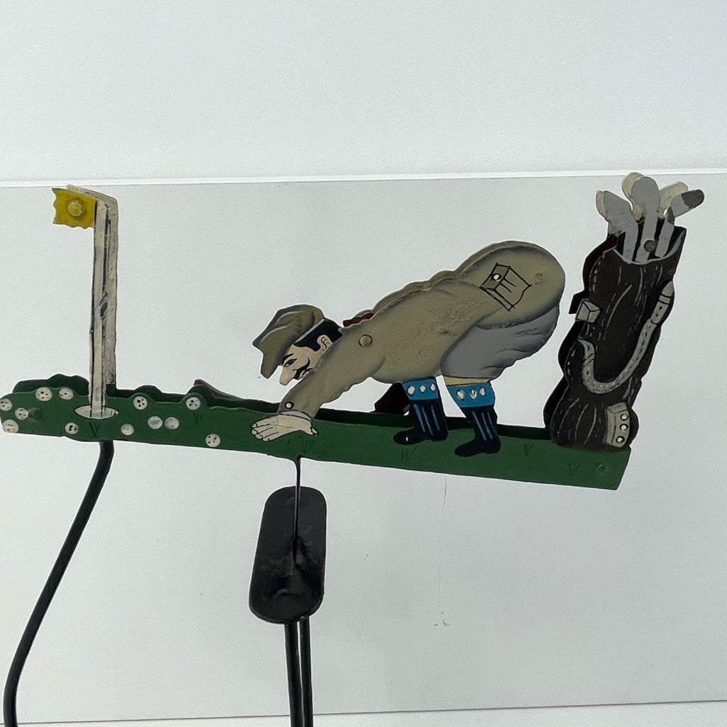 Pendulum Balance Figure - Golfer Lining Up His Putt