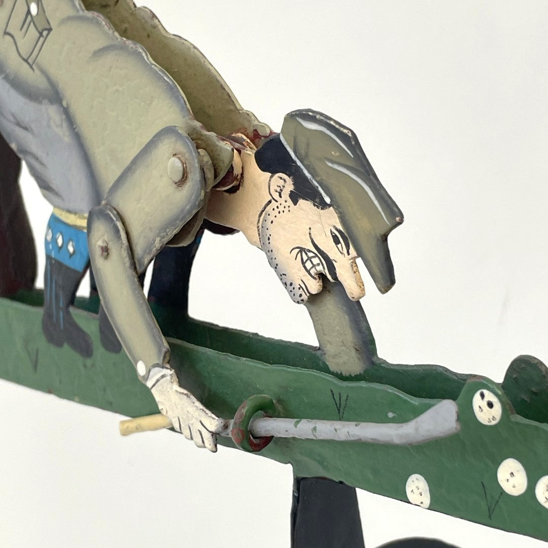 Pendulum Balance Figure - Golfer Lining Up His Putt