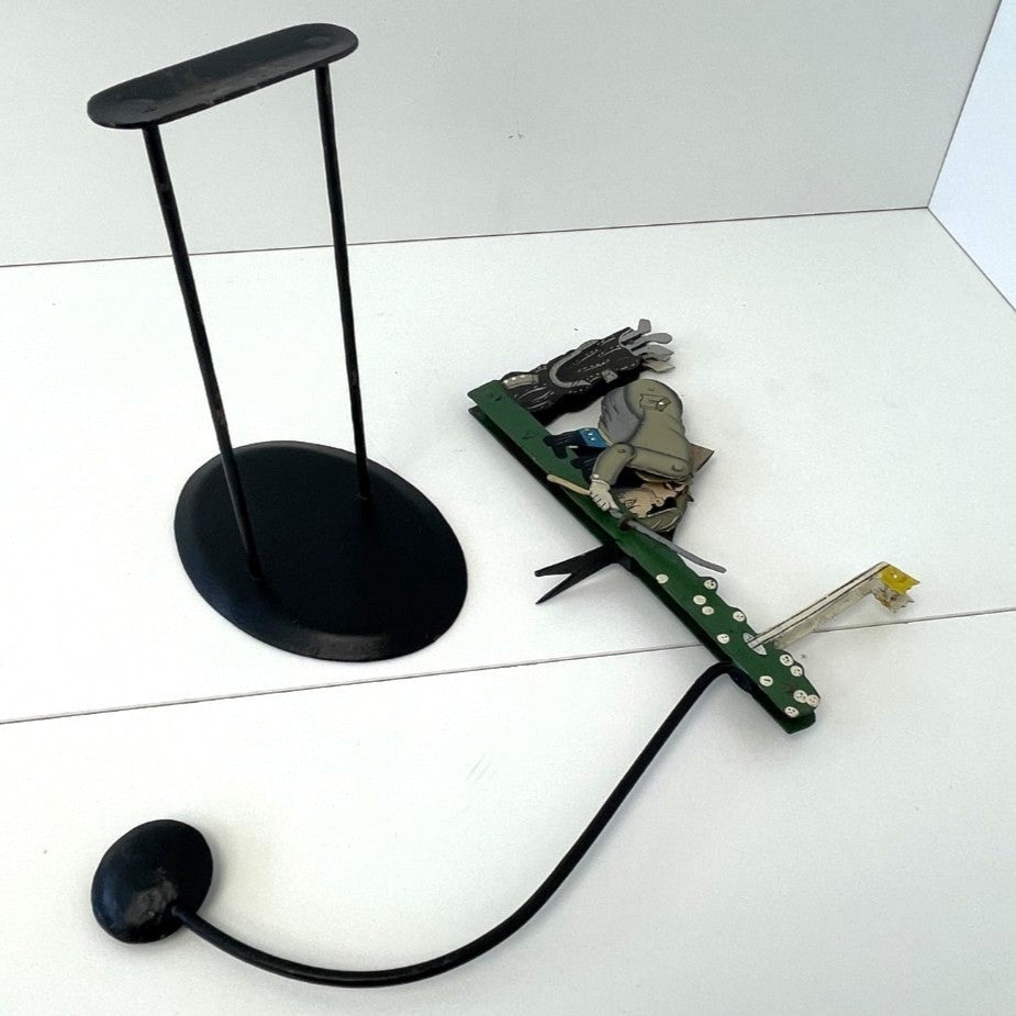 Pendulum Balance Figure - Golfer Lining Up His Putt